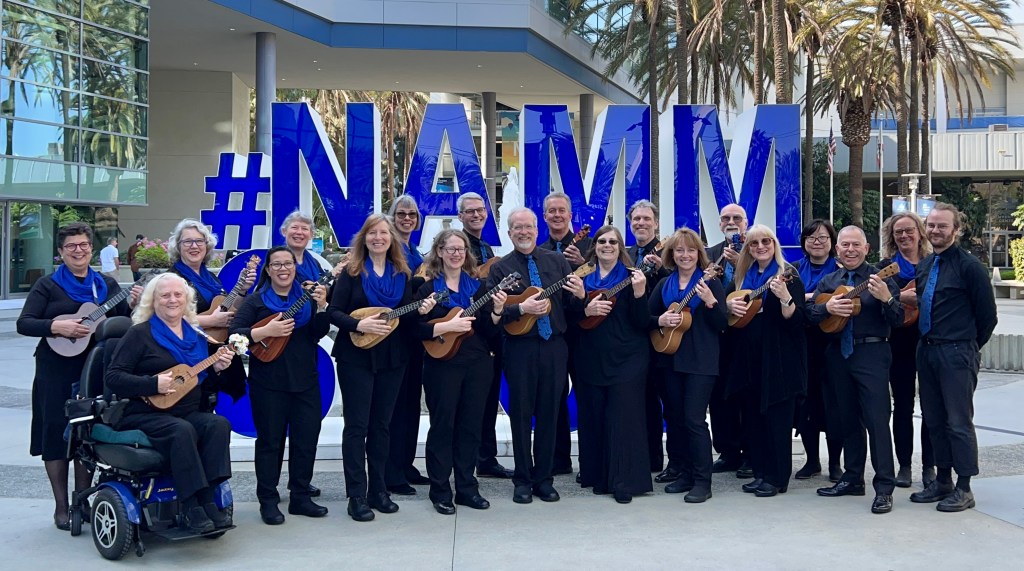 The 20 member Legacy Ukulele Ensemble with Peter Luongo at the NAMM Show in Anaheim CA 2023